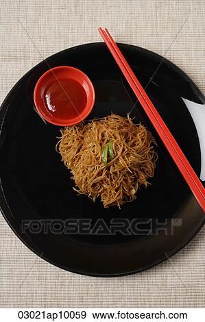 Noodles on plate with chopsticks. View Large Photo Image Stock Photo - Noodles on plate with chopsticks.. Fotosearch