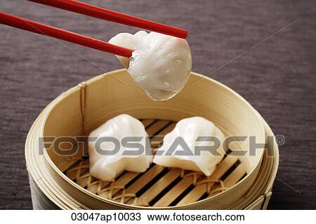 red chopsticks holding dim sum View Large Photo Image Stock Image - red chopsticks holding dim sum. Fotosearch