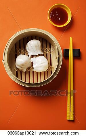 still life of dim sum in bamboo steamer with chopsticks View Large Photo Image Stock Image - still life of dim sum in bamboo steamer with chopsticks. Fotosearch