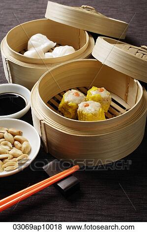 still life of dim sum in bamboo steamers View Large Photo Image Stock Photo - still life of dim sum in bamboo steamers. Fotosearch