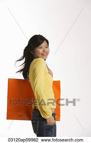 Woman holding large shopping bag. View Large Photo Image Stock Image - Woman holding large shopping bag.. Fotosearch