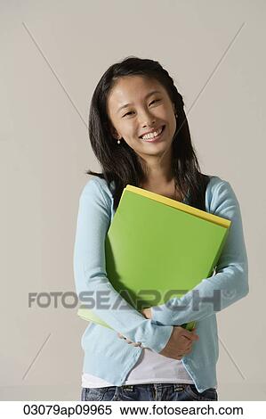 young woman holding folder View Large Photo Image Stock Photography - young woman holding folder. Fotosearch