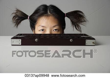 Young woman peering above table with abacus. View Large Photo Image Stock Photo - Young woman peering above table with abacus.. Fotosearch