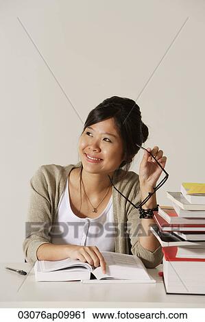 Young woman studying View Large Photo Image Stock Image - Young woman studying. Fotosearch