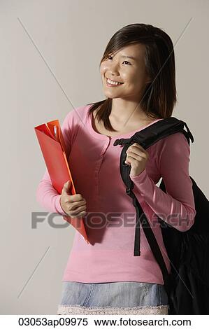 Young woman with backpack and folder. View Large Photo Image Stock Photography - Young woman with backpack and folder.. Fotosearch