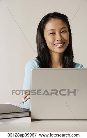 young woman working at laptop. View Large Photo Image Stock Photo - young woman working at laptop.. Fotosearch
