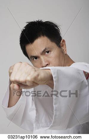 Head shot of Chinese man punching, martial arts View Large Photo Image Stock Photograph - Head shot of Chinese man punching, martial arts. Fotosearch