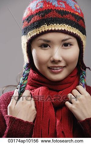 Head shot of Chinese woman in knitted hat View Large Photo Image Stock Photograph - Head shot of Chinese woman in knitted hat. Fotosearch