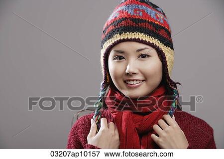 Head shot of Chinese woman wearing knitted hat View Large Photo Image Stock Photo - Head shot of Chinese woman wearing knitted hat. Fotosearch