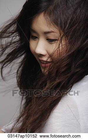 Head shot of Chinese woman with long hair View Large Photo Image Stock Image - Head shot of Chinese woman with long hair. Fotosearch