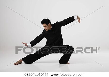 Man doing Tai Chi wearing traditional Chinese clothes View Large Photo Image Stock Image - Man doing Tai Chi wearing traditional Chinese clothes. Fotosearch