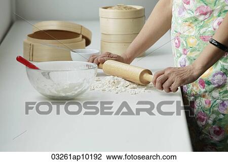Cropped shot of Chinese woman cooking View Large Photo Image Stock Image - Cropped shot of Chinese woman cooking. Fotosearch