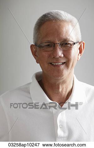 Head shot of gray haired mature man smiling View Large Photo Image Stock Photo - Head shot of gray haired mature man smiling. Fotosearch