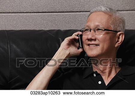 head shot of mature man with grey hair talking on phone View Large Photo Image Stock Image - head shot of mature man with grey hair talking on phone. Fotosearch