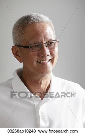 head shot of mature man with grey hair looking away and smiling. View Large Photo Image Stock Photo - head shot of mature man with grey hair looking away and smiling.. Fotosearch