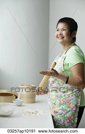 Mature Chinese woman making Dim Sum View Large Photo Image Stock Image - Mature Chinese woman making Dim Sum. Fotosearch