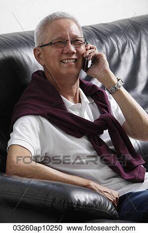older man talking on phone and smiling View Large Photo Image Stock Image - older man talking on phone and smiling. Fotosearch