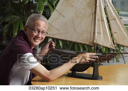 older man with model sail boat View Large Photo Image Stock Image - older man with model sail boat. Fotosearch