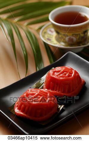 Ang Ku Kueh. Glutinous rice cake with tea. Chinese character for "sweet" on the top. View Large Photo Image Stock Photography - Ang Ku Kueh. Glutinous rice cake with tea. Chinese character for "sweet" on the top.. Fotosearch