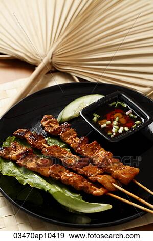 Beef satay with dipping sauce View Large Photo Image Stock Photo - Beef satay with dipping sauce. Fotosearch