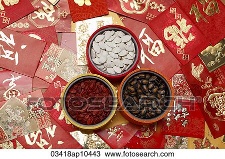Different red envelopes scattered on table with melon seeds in bowls. View Large Photo Image Stock Image - Different red envelopes scattered on table with melon seeds in bowls.. Fotosearch