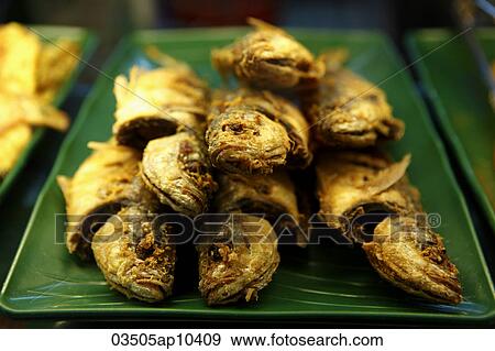 Fried fish on a plate View Large Photo Image Stock Photo - Fried fish on a plate. Fotosearch