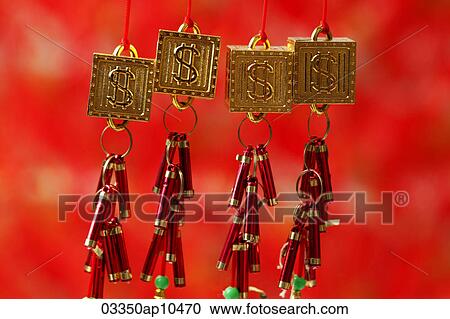 Stock Image - Gold good fortune, dollar sign decorations. Fotosearch