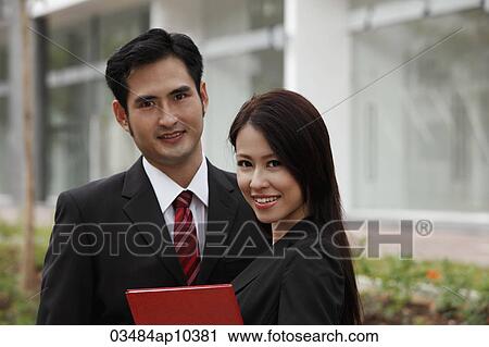 Head shot of man and woman in suits View Large Photo Image Stock Image - Head shot of man and woman in suits. Fotosearch