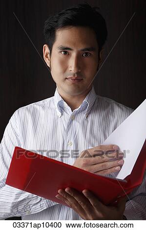 head shot of man holding folder View Large Photo Image Stock Image - head shot of man holding folder. Fotosearch