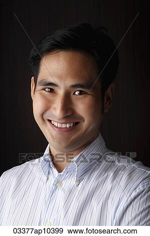 Head shot of man looking at camera and smiling View Large Photo Image Stock Photo - Head shot of man looking at camera and smiling. Fotosearch