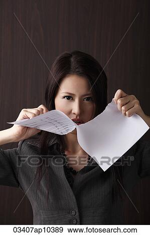 Head shot of woman ripping paper View Large Photo Image Stock Photo - Head shot of woman ripping paper. Fotosearch