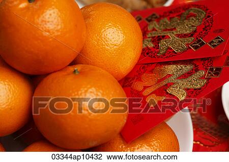 Oranges with red envelopes, Hong Bao, Chinese New Year View Large Photo Image Stock Image - Oranges with red envelopes, Hong Bao, Chinese New Year. Fotosearch