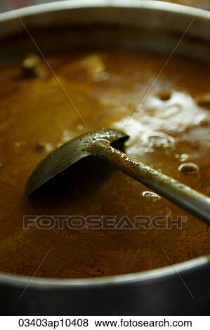 Pot of fish curry. Malay food View Large Photo Image Stock Photo - Pot of fish curry. Malay food. Fotosearch