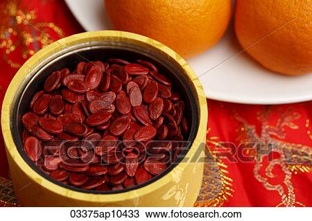 Red "lucky" melon seeds in container View Large Photo Image Stock Image - Red "lucky" melon seeds in container. Fotosearch