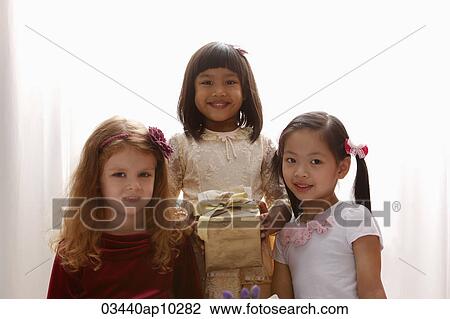 three young girls smiling together View Large Photo Image Stock Image - three young girls smiling together. Fotosearch