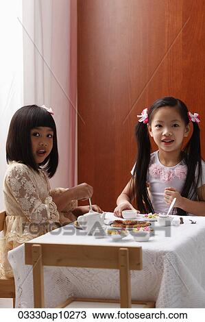 two little girls having a tea party View Large Photo Image Stock Image - two little girls having a tea party. Fotosearch