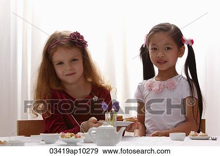 two young girls playing together View Large Photo Image Stock Photo - two young girls playing together. Fotosearch