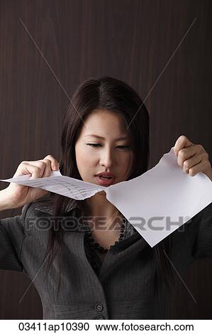 woman ripping paper View Large Photo Image Stock Image - woman ripping paper. Fotosearch