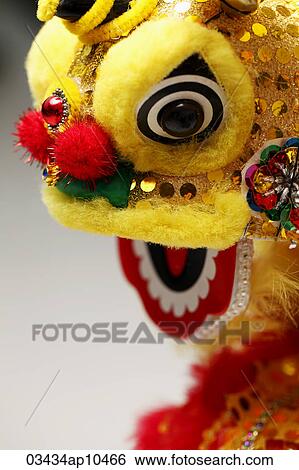Yellow lion head, Chinese New Year decoration View Large Photo Image Stock Photograph - Yellow lion head, Chinese New Year decoration. Fotosearch