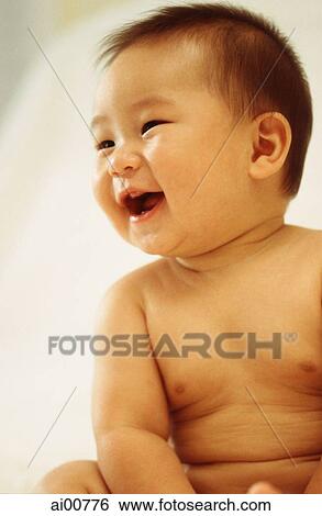 Baby boy (3 - 9 months old) laughing, looking away View Large Photo Image Stock Photograph - Baby boy (3 - 9 months old) laughing, looking away. Fotosearch