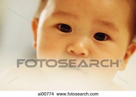 Baby boy (3 - 9 months old) looking curious, close up View Large Photo Image Picture - Baby boy (3 - 9 months old) looking curious, close up. Fotosearch