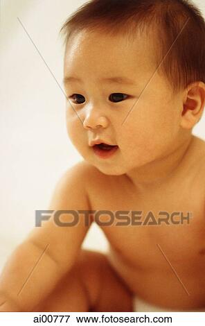 Baby boy (3 - 9 months old) looking curious View Large Photo Image Stock Photo - Baby boy (3 - 9 months old) looking curious. Fotosearch