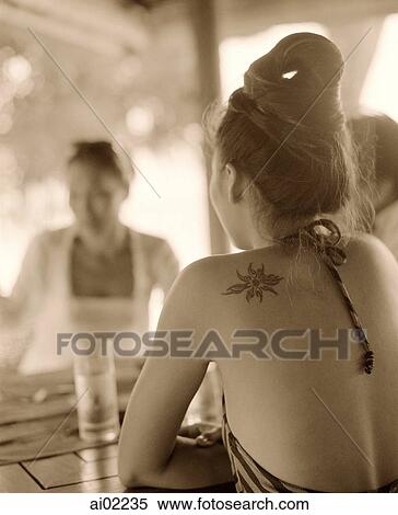 Back of woman at outdoor table View Large Photo Image Stock Photography - Back of woman at outdoor table. Fotosearch