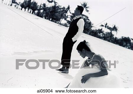 Bride and groom at beach View Large Photo Image Picture - Bride and groom at beach. Fotosearch