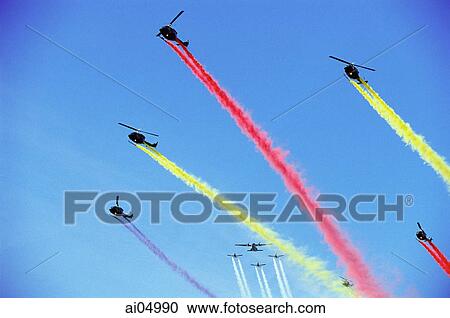Stock Image - Brunei, Air force helicopters and planes conduct a fly-by to celebrate the birthday of Sultan Hassanal Bolkiah of Brunei.. Fotosearch