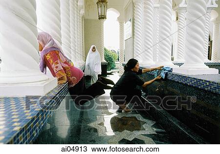 Brunei, Bandar Seri Begawan, Mother and daughters wash before entering prayer hall at Omar Ali Saifuddien Mosque. View Large Photo Image Stock Image - Brunei, Bandar Seri Begawan, Mother and daughters wash before entering prayer hall at Omar Ali Saifuddien Mosque.. Fotosearch