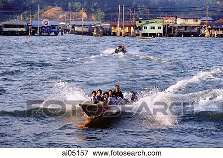 Stock Photo - Brunei, fast water taxies shuttle between Kampong Ayer and Bandar Seri Begawan.. Fotosearch