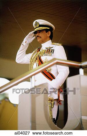 Stock Photo - Brunei, Sultan Hassanal Bolkiah saluting during military ceremony in honor of his birthday.. Fotosearch