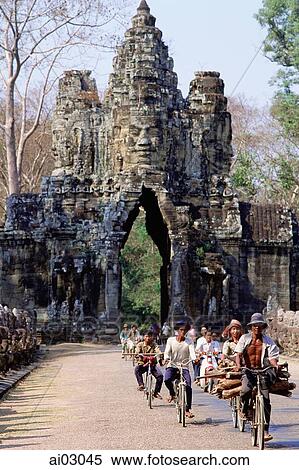 Cambodia, Angkor Thom, cyclists leaving the south gate View Large Photo Image Stock Photography - Cambodia, Angkor Thom, cyclists leaving the south gate. Fotosearch