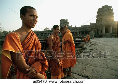 Cambodia, Angkor Wat, Young monks on stone path to temple View Large Photo Image Stock Photograph - Cambodia, Angkor Wat, Young monks on stone path to temple. Fotosearch